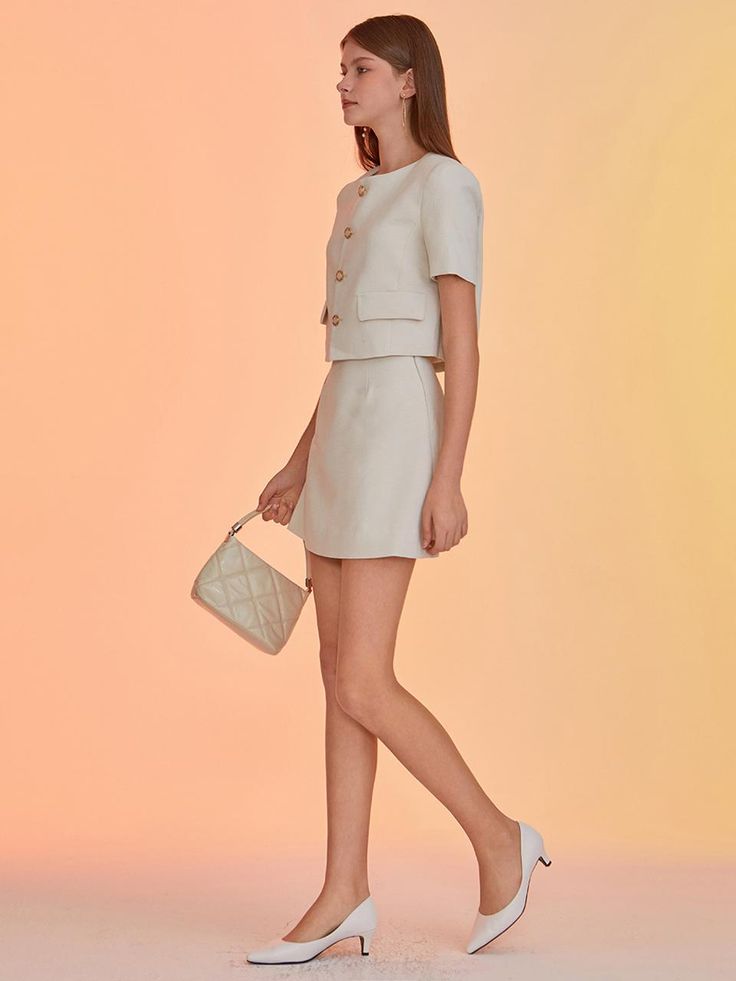 This product, the Venla Linen Mini Skirt, encapsulates timeless elegance in a contemporary design. With its high-waisted fit and straight silhouette, the skirt ensures a flattering shape for various figures. The simplicity of the design is punctuated by subtle detailing, making it a versatile piece for both casual and formal occasions. - The Venla Linen Mini Skirt offers a high-waisted design that elongates the figure and pairs seamlessly with cropped or tucked-in tops.- A clean, straight cut provides a timeless silhouette, while the skirt's minimalistic appeal is enhanced by fine stitching and discrete fastenings.- Constructed with quality linen, this skirt promises both durability and breathability for all-day comfort.- The inclusion of side pockets combines functionality with a cas Formal Mini Skirt For Summer, Feminine Mini Skirt For Formal Occasions, Feminine Formal Mini Skirt, Elegant Mini Skirt For Spring, Elegant Fitted Mini Skirt For Summer, Formal Spring Mini Skirt, Chic Short Pleated Skirt, Elegant Mini Pencil Skirt For Summer, Elegant Mini Length Summer Pencil Skirt