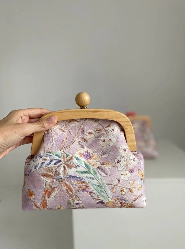 Shoulder Wooden Frame Handbag - Gifts idea for her, Bag for Mother, Bag for sister, Christmas gift idea, Clutch handbag, little handbag A stunning handbag adorned with delicate watercolor flowers, light and airy. It's like carrying a whole summer of blooms with you. Material - fabric. Wooden lock Size - 9x6.7x3.14inch (23x17x8cm) The strap is pink and made from a leather substitute. The length is adjustable, with a maximum length of 45inch (115cm) Let me know if any questions or you need more photos. Handheld Bags As Gifts, Evening Bag With Detachable Top Handle, Evening Bag With Detachable Top Handle For Gifts, Portable Handheld Bags For Gifts, Handheld Portable Bags As Gifts, Feminine Bag With Detachable Handle As Gift, Top Handle Pouch With Removable Pouch As Gift, Handheld Zipper Pouch Cosmetic Bag As Gift, Handheld Zippered Pouch As Gift