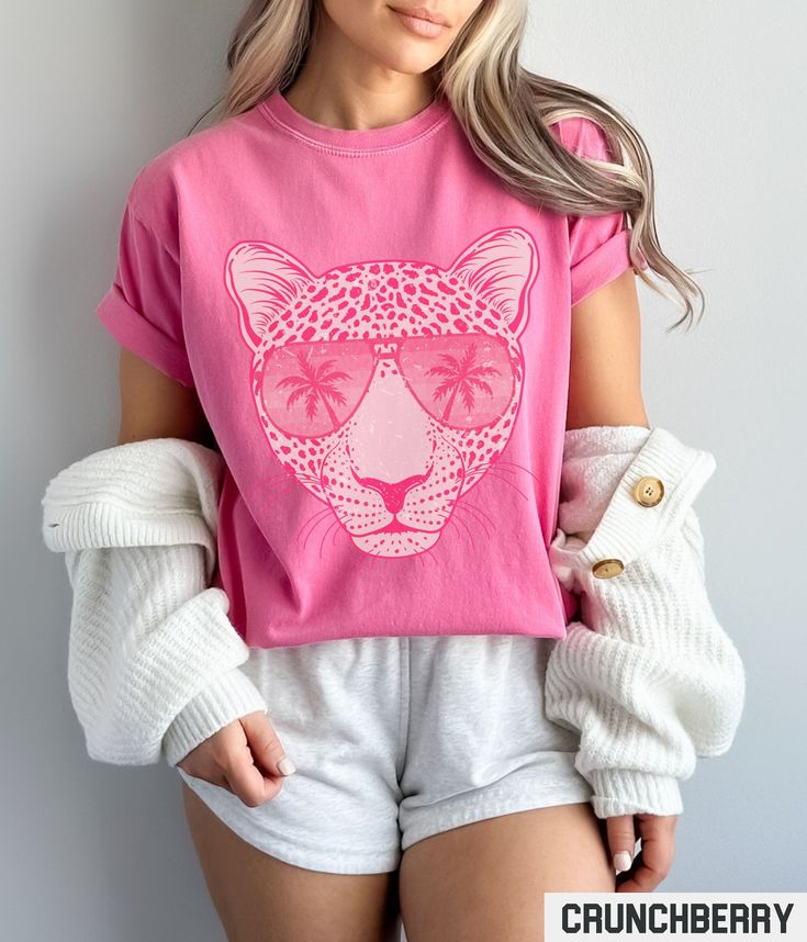 Our retro style graphic tee features a hot pink leopard with sunglasses design. This trendy and aesthetic graphic crewneck gives off perfect Summer vibes. ✩ ✩ 𝗞𝗶𝗱𝘀 𝗖𝗼𝗺𝗳𝗼𝗿𝘁 𝗖𝗼𝗹𝗼𝗿𝘀 𝗧𝗲𝗲: https://starrieapparel.etsy.com/listing/1739105300 ✩ 𝗔𝗱𝘂𝗹𝘁 𝗖𝗼𝗺𝗳𝗼𝗿𝘁 𝗖𝗼𝗹𝗼𝗿𝘀 𝗧𝗲𝗲: https://starrieapparel.etsy.com/listing/1729335814 Hot Pink Leopard Shirt, Trendy Summer Graphic Tee, Cheetah T-shirt, Vacation Tshirt, Comfort Colors Plus Size Animal Print Tee Birthday Gift SIZE Casual Leopard Print Crew Neck T-shirt, Trendy Leopard Print Graphic T-shirt, Trendy Cotton T-shirt In Leopard Print, Trendy Leopard Print T-shirt With Crew Neck, Trendy Short Sleeve Leopard Print T-shirt, Summer Leopard Print Tops With Graphic Print, Leopard Print Graphic Tee With Crew Neck, Summer Leopard Print Top With Graphic Design, Graphic Tee With Leopard Print And Crew Neck