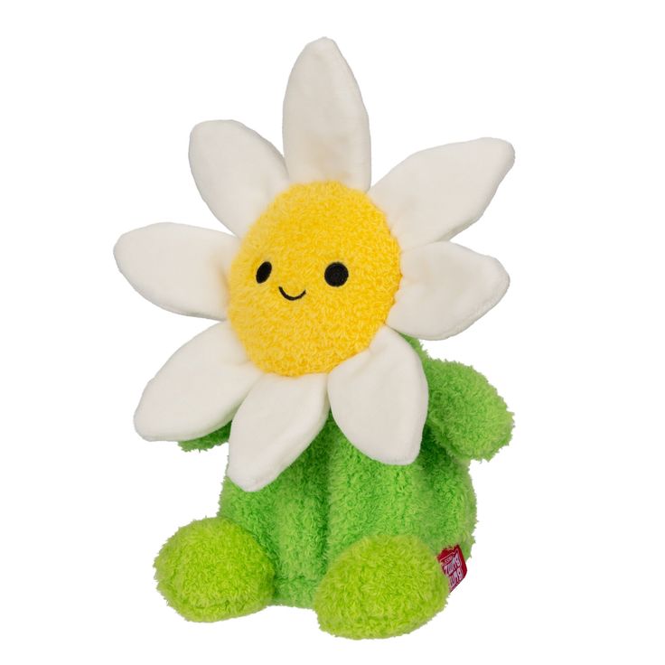 a green stuffed animal with a white flower on it's back and yellow petals