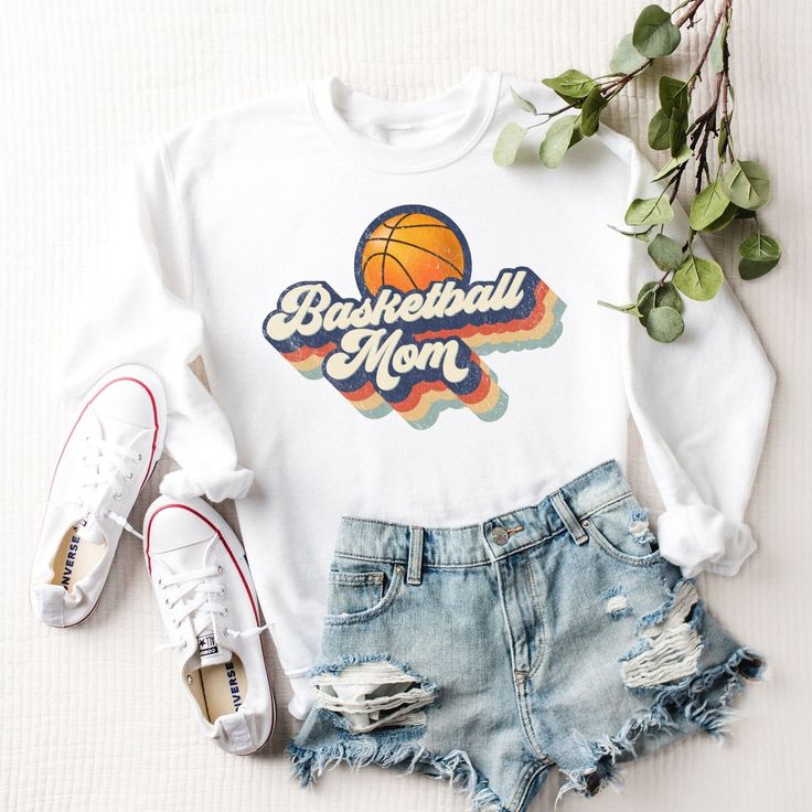 "Basketball Mom Shirt, Sports Mom Sweatshirt, Basketball Mama, Mom Sweatshirt, Funny Mom Shirts, Retro Basketball Mom Sweater, Best Gifts Our retro basketball mom sweatshirt is so adorable and is perfect for any Mama you know, including yourself! :) This football mom sweater is made with a professional DTG Printing machine with eco-friendly water based inks that prints the image/designs on the shirt allowing the image to become part of the shirt so there is no peeling or cracking over time. If y Collegiate White Sweatshirt With Screen Print, White Collegiate Sweatshirt With Screen Print, White Collegiate Style Sweatshirt With Screen Print, Relaxed Fit Sweatshirt With Lettering For Sports Events, Relaxed Fit Lettering Sweatshirt For Sports, Cotton Sweatshirt With Screen Print For Sports Season, Retro Crew Neck Tops For Sports Season, Varsity Sports Top With Lettering, Relaxed Fit Screen Print Sweatshirt For Sports Season