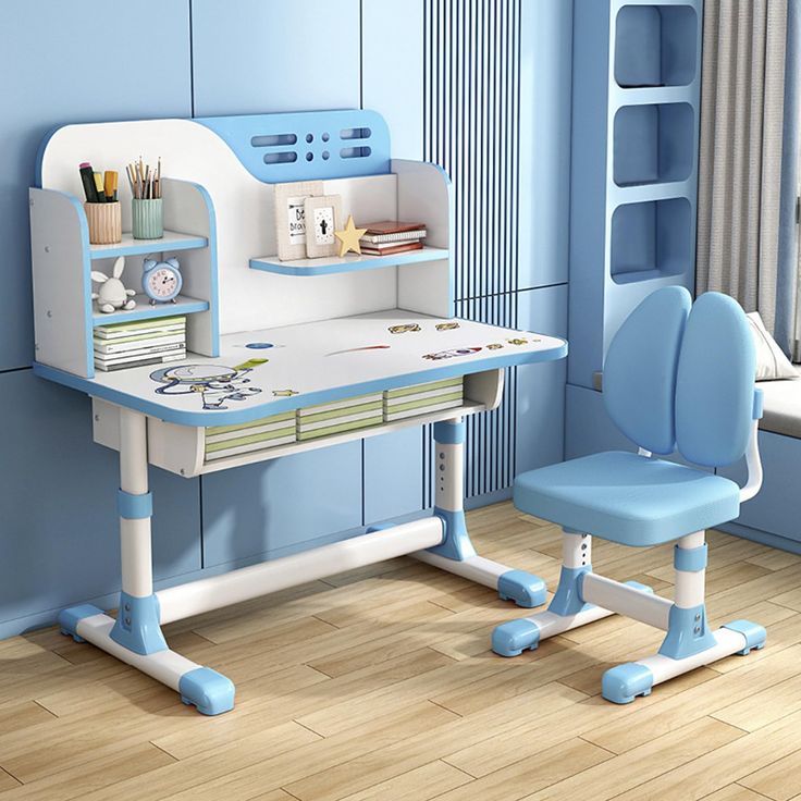 a child's desk and chair in a blue room