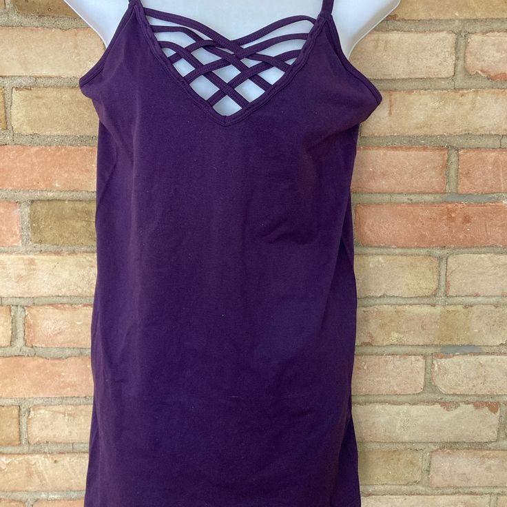 Dark Eggplant Purple Plus Size Camisole With Strappy Cross Crossed Front Neckline. Adjustable Bra Style Back Straps. Seam Free. Nylon Spandex. Size 1x/2x. New Never Worn. Measurements Taken Flat: Bust 16”, Total Length 27”. Smoke/Pet Free Home. Summer Crisscross Strap Tops, Stretch Crisscross Strappy Tops, Stretch Crisscross Straps Strappy Top, Sleeveless Tops With Crisscross Straps For Vacation, Crisscross Top With Built-in Bra, Sleeveless Strappy Tops For Loungewear, Purple Stretch V-neck Tank Top, Fitted Casual Camisole With Crisscross Straps, Casual Fitted Camisole With Crisscross Straps