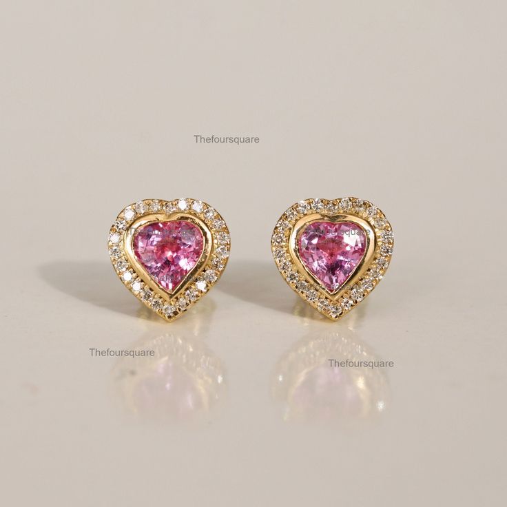 Heart Shape Pink Sapphire & Diamond Halo Mini Stud Earrings, Women Wedding Earrings, Bridal Earrings, Gift For Her, Handmade Jewelry, September Birthstone Earrings. Great Gift For Mom, Sister, Friend, Girlfriend and Daughter. Also available in Rose Gold, White Gold and Yellow Gold. 𝐏𝐫𝐨𝐝𝐮𝐜𝐭 𝐢𝐧𝐟𝐨: 𝟏𝟒𝐤 𝐬𝐨𝐥𝐢𝐝 𝐠𝐨𝐥𝐝 ★𝐃𝐞𝐭𝐚𝐢𝐥𝐬 ★𝐒𝐊𝐔 𝐂𝐨𝐝 : 2711 ★𝐏𝐮𝐫𝐢𝐭𝐲 : Solid 14k Gold ( Also available in 9k & 18k Solid Gold) ★𝐌𝐞𝐭𝐚𝐥 : Yellow Gold ( Also available in Rose Gold Valentine's Day Formal Heart Gemstone Earrings, Birthstone Earrings For Valentine's Day, Pink Heart-shaped Gemstone Earrings, Fine Jewelry Heart Earrings For Wedding On Valentine's Day, Heart Cut Gemstone Earrings For Wedding, Pink Heart Gemstone Earrings, Wedding Heart Cut Gemstone Earrings, Valentine's Day Heart Gemstone Earrings, Fine Jewelry Heart-shaped Earrings With Halo Design