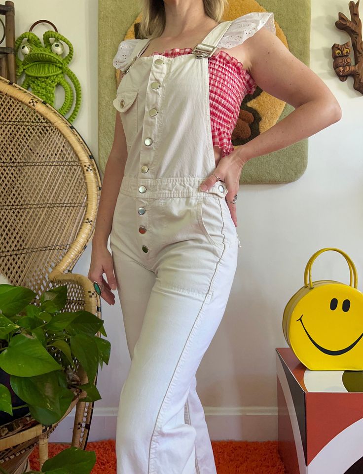 "Unique 1970s Hang Ten overalls in a nice and neutral light khaki/cream color Button front + at pockets Cotton canvas material Est to fit an XS-S depending on desired fit but go by measurements below. Buyer is responsible for confirming fit and sales are final. If you have any questions please let me know! Model is 5'2 34/27/38, these were a good fit other than the hips CONDITION: great vintage condition w/ some typical wear and minor distressing - see pics MEASUREMENTS: (taken laying flat then Beige Cotton Overalls, Cream Cotton Jumpsuits And Rompers With Pockets, Beige Overalls For Spring, Vintage Cotton Denim Jumpsuit With Button Closure, Retro Spring Overalls With Bib Front, Vintage White Jumpsuits And Rompers For Spring, Vintage Spring Overalls With Bib Front, Fitted Beige Overalls For Spring, Overalls Flare