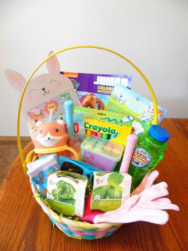 a basket filled with lots of toys on top of a wooden table