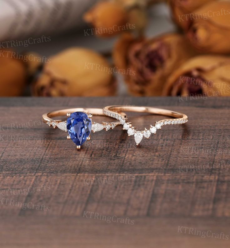 "MADE TO ORDER * Material: Solid gold(14K/18K white/yellow/rose gold) * DETAILS  Engagement ring - center stone: Lab sapphire 6*8mm pear cut - width: approximately 1.5mm  - thickness: approximately 1.3mm Side stone:Moissanite or Diamond - diamond:0.16ct,2*3mm pear cut,Color G-H,Clarity SI-VS - moissanite:0.16ct Wedding band Stone:Moissanite or diamond - diamond:2*3mm Pear cut Half eternity,Color G-H,Clarity SI-VS - moissanite:2*3mm Pear cut Half eternity, * Click on the \"Pin It\" icon if you li Saphire Engament Ring Teardrop, Sapphire Engagement Ring Pear Shaped, Sapphire Teardrop Ring, Teardrop Sapphire Ring, Pear Cut Sapphire Engagement Ring, Pear Gemstone Engagement Ring, Pear Sapphire Engagement Ring, Sapphire Pear Engagement Ring, Teardrop Rings