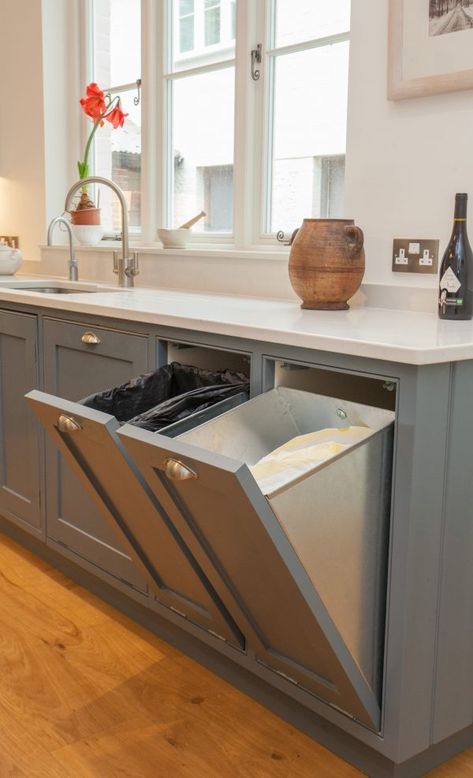 an open dishwasher in the middle of a kitchen