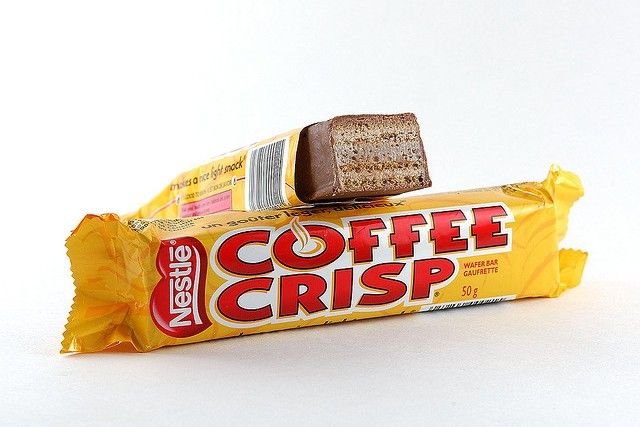 two bars of coffee crisp are stacked on top of each other in front of a white background