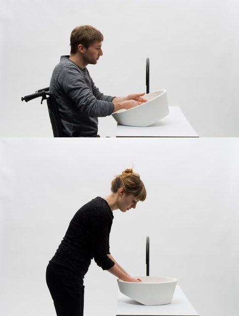 a woman standing in front of a white bowl