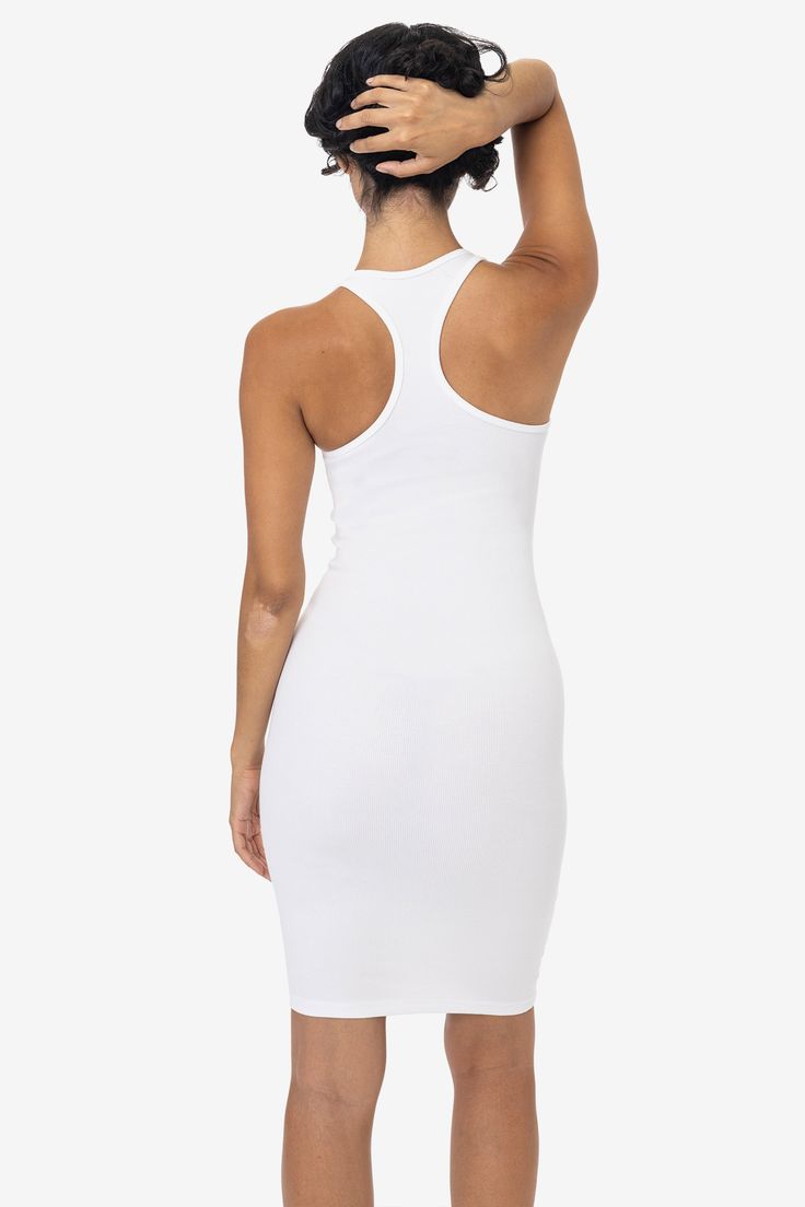 This sporty racerback dress is made of a heavy 2x1 rib with spandex so it has a flattering stretch. This textile features more compression than our regular cotton spandex styles and has been garment dyed and washed, so it is shrink-free, in 3 basic colors for your wardrobe. The mid-length of this dress makes it perfect for wearing day to night and is perfect for spring and summer. Made in Los Angeles, Calif. by sewers who are paid up to $20 an hour or more with benefits and overtime. • 2x1 Rib• Ribbed Stretch Bodycon Dress, Stretch Ribbed Elastane Bodycon Dress, Stretch Ribbed Bodycon Dress, Ribbed Stretch Mini Length Tank Top, Stretch Ribbed Mini Length Tank Top, Ribbed Stretch Mini Tank Top, White Ribbed Stretch Bodycon Dress, Stretch Ribbed Cropped Tank Top, Fitted Racerback Bodycon Dress For Spring