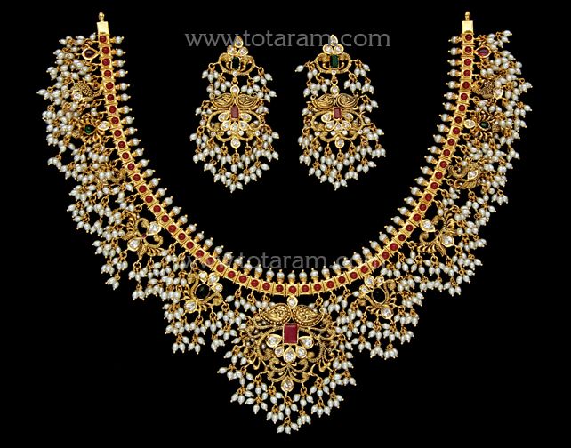 22 karat gold "guttapusalu - peacock" necklace & drop earrings set with cz , pearls & beads (temple jewellery)  - 235-GS3593 - in 128.700 Grams for USD $12,105.37 USD. 
Made in India by Totaram Jewelers Online this product is in Gold - 22 Karat BIS Hallmark 916 Gold  & is an excellent gift for Adult - Women. Ships fully insured with secured guaranteed delivery for free with your order over $250 from New Jersey USA & comes with 30 days exchange policy. Guttapusalu Haram, Gutta Pusalu, Peacock Necklace, Pearl Necklace Designs, Coral Beads, Temple Jewellery, Bead Jewellery, Gifts For Adults, 22k Gold