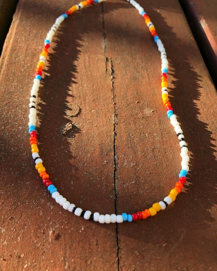 Beaded native and western inspired necklace White Hippie Beaded Necklace For Festivals, Hippie White Beaded Necklace For Festivals, Hippie Style White Beaded Necklace For Festivals, Handmade Western Beaded Necklaces As Gift, Handmade Western Beaded Necklaces For Gifts, Western Style Beaded Necklaces For Festivals, White Southwestern Hand-strung Beaded Necklace, Southwestern White Hand-strung Beaded Necklace, Southwestern Style White Beaded Necklace With Large Beads