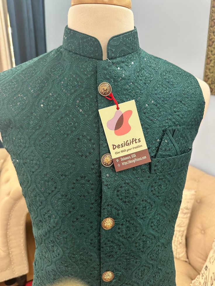 **Visit our store for full collection: https://www.etsy.com/shop/DesiGiftsUSA ** *This sleeveless jacket is crafted with intricate embroidery and sequins. It is lightweight yet high on durability carrying a distinct texture and appearance.  It enhance the elegance of men's wear from formal to casual, wedding, and other auspicious occasions. * The jacket is also known as Indian or Ethnic Style Jacket, Collar Waistcoat, Sadri, Nehru or Modi Jacket. *Pair it with Kurta-Pajama for ethnic look. Pair it with Shirt & Trousers to give a Indo-Western look. *Fabric : Silk blend Design: J- 1458 Actual color of the dress may slightly vary due to the screen resolution.  Refer the size chart for measurements Care: Dry cleaning is recommended Disclaimer: -Actual color of the dress may slightly vary due t Mens Indian Wear, Jacket Collar, Nehru Jacket, Ethnic Looks, Kurta Pajama, Western Look, Nehru Jackets, Intricate Embroidery, Indo Western