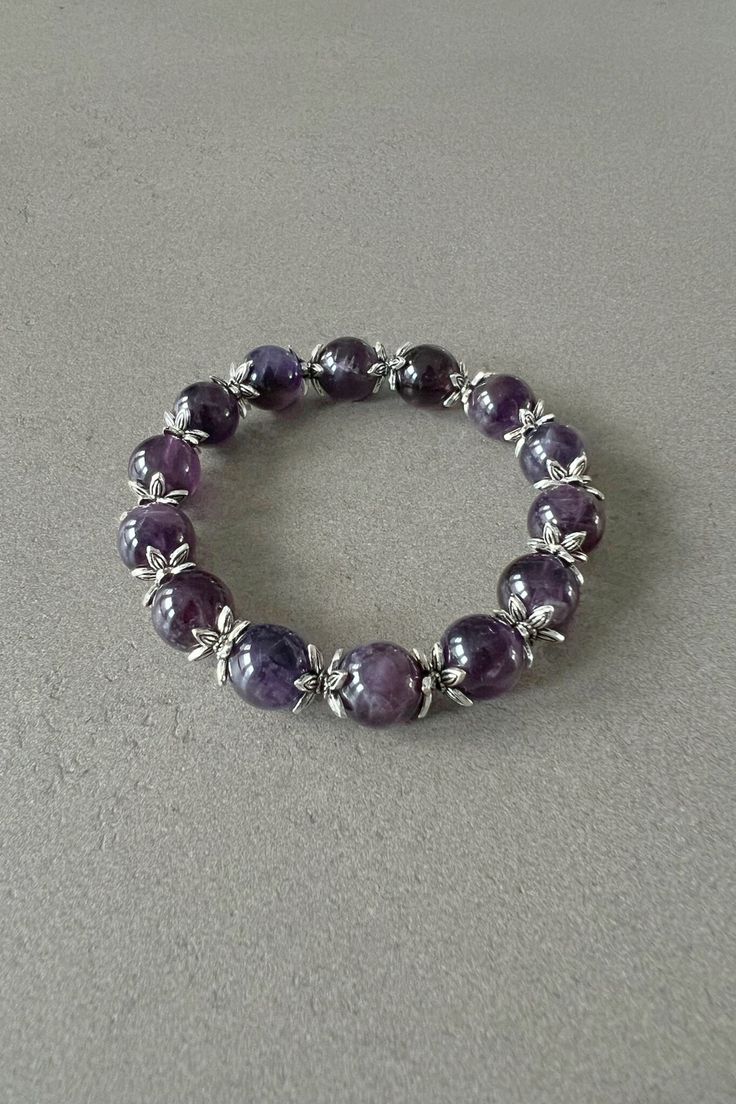 Amethyst bracelet for her amethyst beaded bracelet with natural amethyst gemstone bracelet adjustable amethyst bracelet gift for best friend Expertly crafted, this Handmade Beaded Bracelet showcases the stunning beauty of purple amethyst stones and intricate star-shaped spacers in antique silver color. Each piece is unique and adds a touch of elegance to any outfit. A true statement accessory with natural healing properties, this bracelet is a must-have for any fashion-forward individual. Intere Amethyst 8mm Beads Jewelry Gift, Purple Crystal Bracelet With 8mm Beads As A Gift, Lavender 8mm Beads Jewelry For Healing, Amethyst Crystal Bracelet As Spiritual Gift, Amethyst Crystal Bracelet For Spiritual Gift, Spiritual Amethyst Crystal Bracelet As Gift, Lavender Natural Stones Jewelry Gift, Purple Bracelets With 8mm Beads As Gift, Purple 8mm Beads Bracelets As Gift