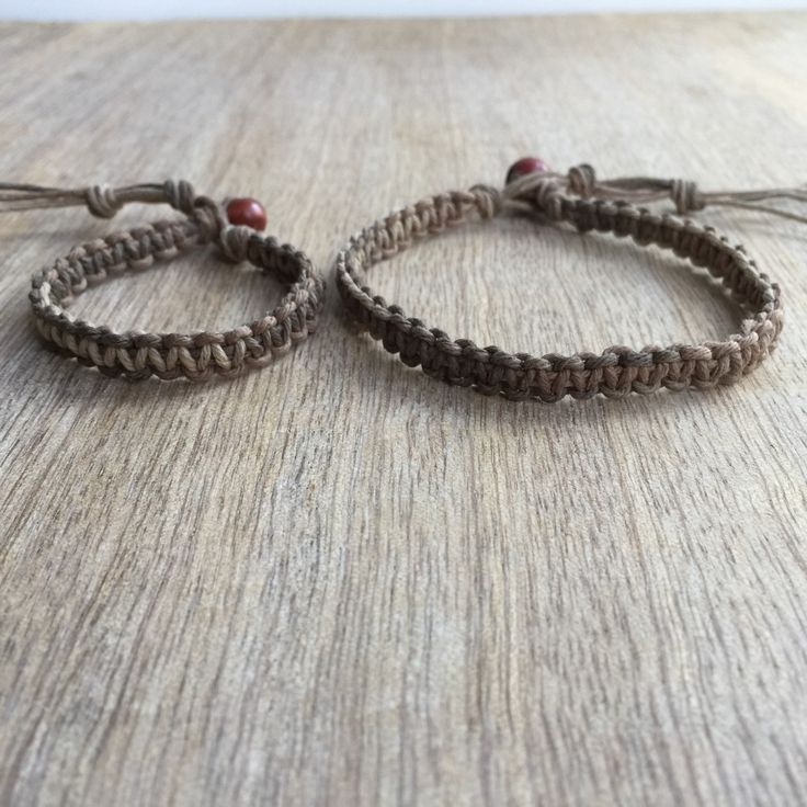 "These lovely bracelets were made using hemp cord. Designed for everyday wear. Both bracelets are adjustable. The big bracelet closes to around 7\"-8\" and the small one closes to around 5\"-6\". Please feel free to contact me if you have any questions For more Daddy and me/ Mom and Son Bracelets: https://www.etsy.com/shop/Fanfarria?section_id=17007792&ref=shopsection_leftnav_4 Check all Fanfarria's products: https://www.etsy.com/shop/fanfarria?section_id=16963242&ref=shopsection_leftnav Adjustable Beige Friendship Bracelets As A Gift, Earthy Macrame Braided Bracelet Gift, Earthy Handmade Friendship Bracelets, Handmade Earthy Adjustable Braided Bracelets, Handmade Brown Braided Bracelets For Friendship, Earthy Handmade Adjustable Braided Bracelets, Brown Macrame Beaded Bracelets For Friendship, Handmade Brown Braided Friendship Bracelets, Brown Hand Wrapped Braided Bracelets For Friendship