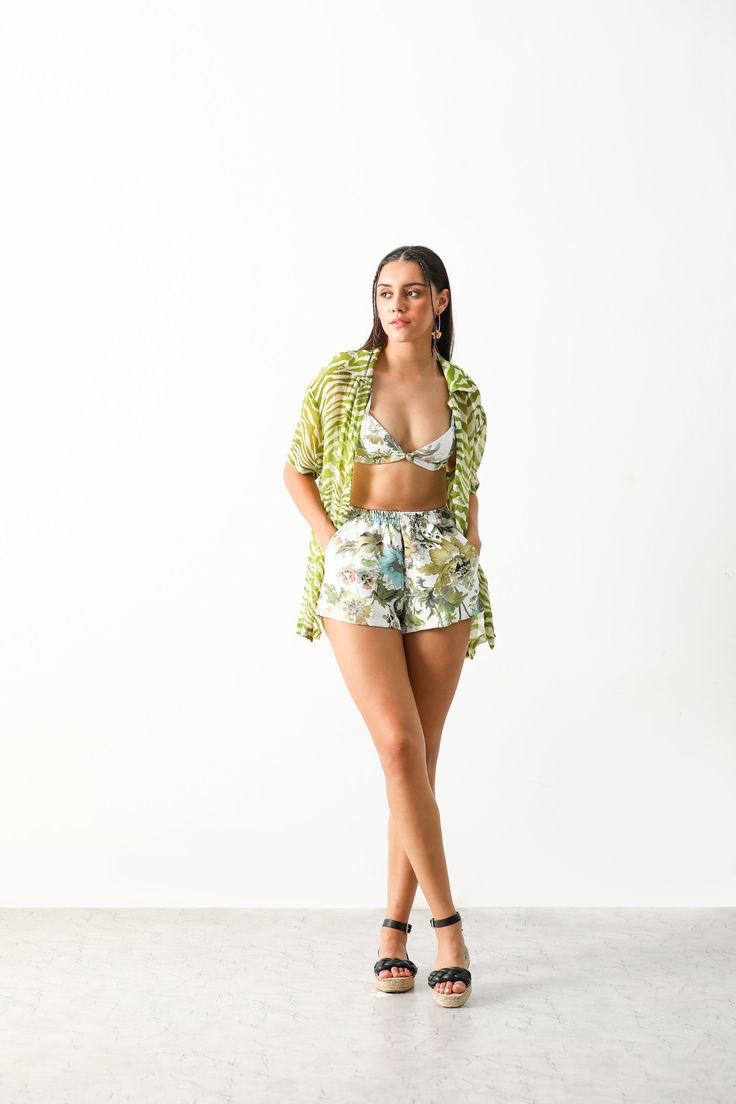 Product Name: RIONA CO-ORD (BRALETTE & SHORTS)Product Description:The Iaso riona set crafted in cotton polyester satin fabric featuring a bralette & shorts.A perfect set for a beach day.Size and Fit: Fits true to size Intended for a Relaxed fit Bralette neckline at 12" Elasticated at the back & shoulder tie up for adjustable fit Non stretchy fabric Pull on shorts with elasticated waist Model is 175cm/ 5'8" and is wearing small size Shorts length is 14" Bralette length is 13" Details and Care: COLOR:White COMPOSITION:Cotton & Polyester mix CARE: Dry clean only PLACE OF ORIGIN: India DELIVERY TIME: 12-14 Working Days Summer Cotton Sets With Built-in Shorts, Green Beach Sets In Short Shape, Summer Vacation Sets With Short Length, Summer Vacation Short Set, Summer Vacation Sets In Short Length, Short-length Beach Vacation Sets, Spring Short Set, Summer Beachwear Sets With Short Length, Beach Sets For Summer With Short Length