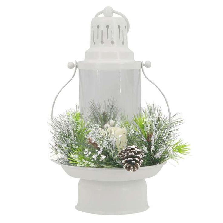 a white bird feeder with pine cones and greenery in it's centerpiece