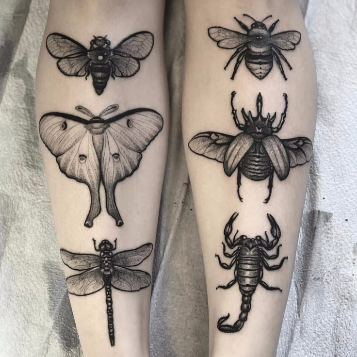 two legs with different types of tattoos on them