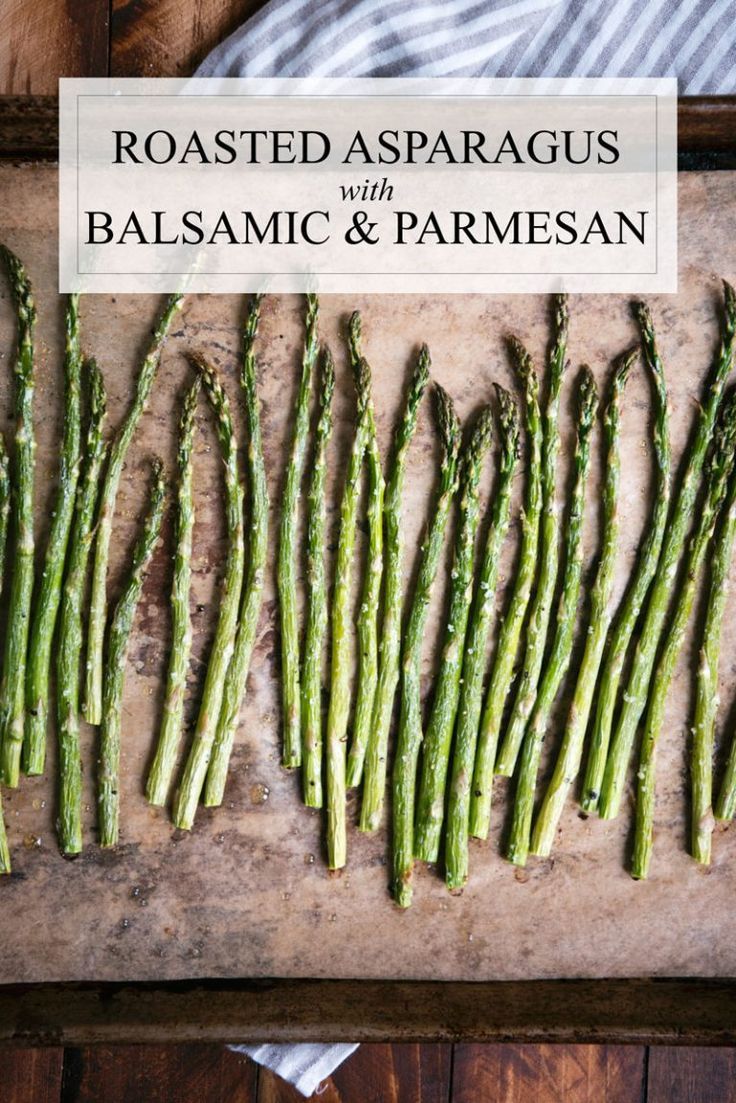 roasted asparagus with balsamic and parmesan on a cutting board