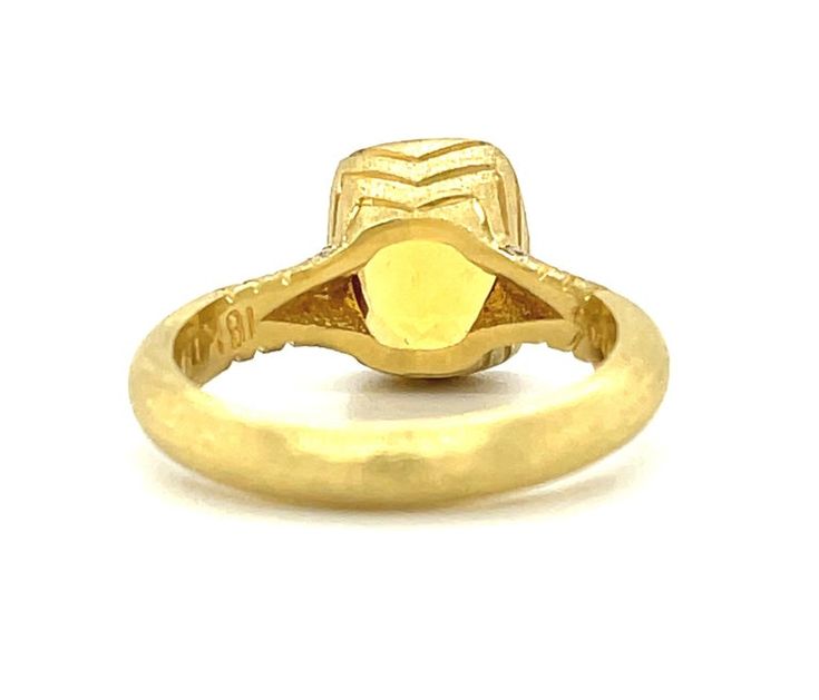 Featuring a golden honey-colored yellow beryl, this handcrafted ring was exquisitely made in 18k yellow gold which emphasizes the rich color of the center stone. The cushion-cut yellow beryl is bezel set with brilliant white diamonds adorning the lovely textured band. This gold on gold toned ring goes with everything! Fun fact: golden beryl comes from the same mineral family as emeralds, aquamarines and morganites!Yellow beryl, 9.49 x 7.79mm cushion cut, 2.76 carats10 round brilliant cut diamond Yellow Sapphire Ring With Center Stone In Yellow Gold, Luxury Yellow Ring With Bezel Setting, Luxury Yellow Rings With Bezel Setting, Formal Yellow Rings With Single Cut Diamonds, Yellow Gold Ring With Yellow Sapphire Center Stone, Yellow Gold Yellow Sapphire Ring With Center Stone, Gold Citrine Diamond Ring With Brilliant Cut, Yellow Gold Topaz Ring With Yellow Sapphire Center Stone, Heirloom Yellow Gold Ring With Yellow Sapphire