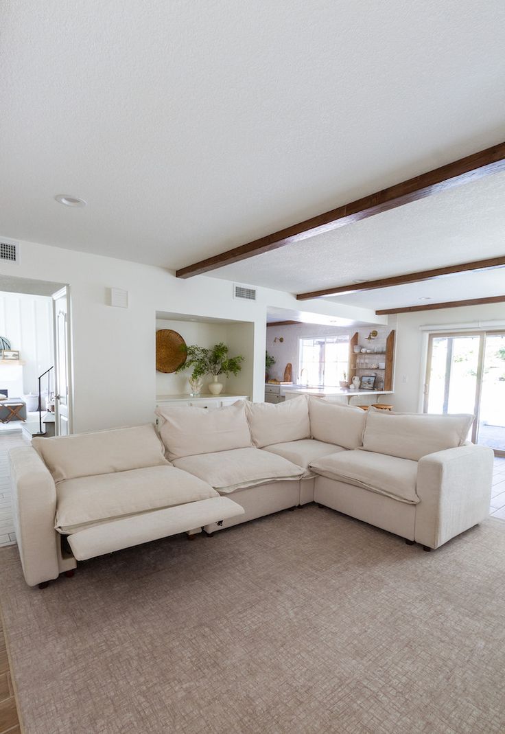 a living room with a large sectional couch