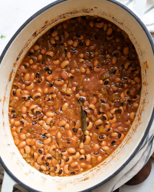 a pot filled with beans on top of a table