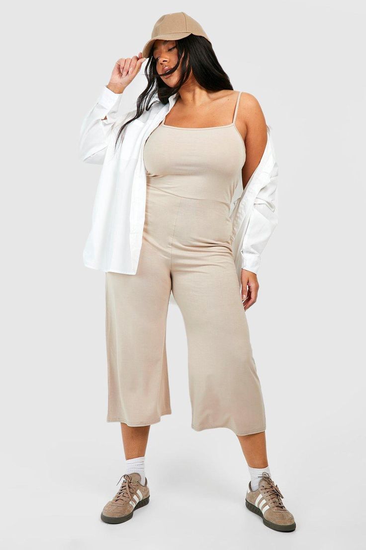 Womens Plus Jersey Knit Basic Culotte Jumpsuit - Beige - 22 - When it comes to effortless style, a plus-size jumpsuit or romper ticks all the right boxes. These all-in-one garments are perfect for balancing the shoulders and hips while also being curve flattering. A plus-size black jumpsuit is an excellent option for its slimming silhouette. For the ultimate 9 to 5 outfit, pair it with some chelsea boots and a longline wool coat. If you want to look chic and catch eyes, then a plus-size white ju Tan Jumpsuit Plus Size, Plus Size Romper Jumpsuits, Forever 21 Plus Size Jumpsuit, Culotte Jumpsuit, Plus Size Romper, Vintage Pants, White Jumpsuit, Plus Size Jumpsuit, Black Jumpsuit