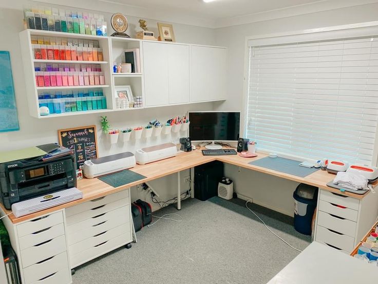 an office with lots of crafting supplies on the desk