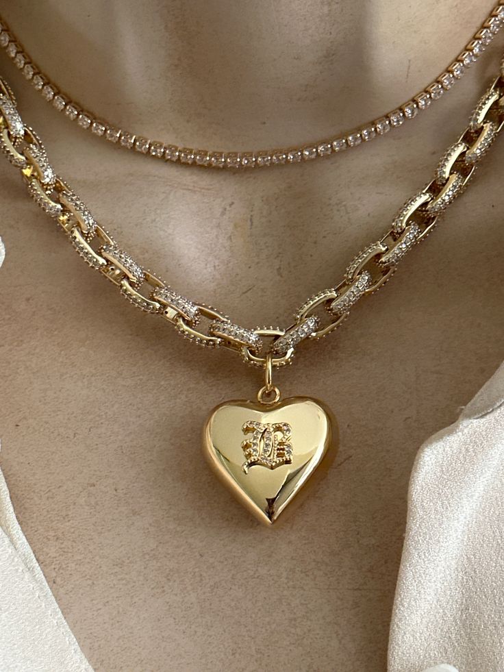 Personalized statement necklace features a gold plated stainless steel heart with custom CZ old English initial (choose at the checkout). Gold plated brass chunky chain features micro pave CZ and textured links. Adjustable length is 16-18 inches. Lobster clasp. 🎁All orders are shipped in a gift box. Trendy Yellow Gold Heart Charm Jewelry, Trendy Yellow Gold Jewelry With Heart Charm, Gold Charm Necklace With Chunky Chain For Gifts, Dainty Chain Jewelry For Valentine's Day, Gold Chain Charm Necklace For Anniversary, Trendy Gold Plated Heart Pendant Jewelry, Chunky Chain Pendant Jewelry Gift, Dainty Valentine's Day Jewelry Chain, Gold Chain Charm Necklace For Valentine's Day