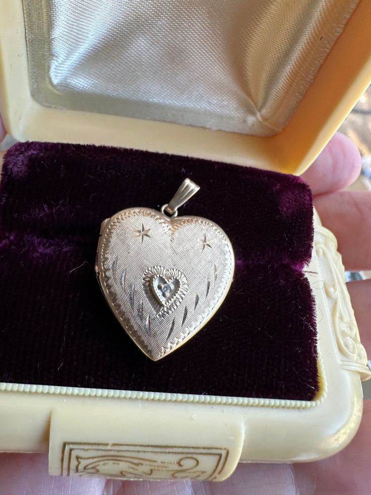 Beautiful Vintage Heart Locket   set with a tiny clear stone and beautiful etched design in the front. it is stamped 14 karat on the inside of the locket , it weighs 2.2 grams and is approx.7/8 of an inch in length and 3/4 of an inch wide. as with most vintage items this has slight surface wear , and closes securely . Message me with any questions Classic Heart Jewelry For Collectibles, Classic Heart-shaped Collectible Jewelry, Classic Heart Shaped Collectible Jewelry, Collectible Heart-shaped Hallmarked Jewelry, Heirloom Oval Jewelry For Valentine's Day, Heirloom Heart Locket Jewelry, Heirloom Heart Shaped Locket Jewelry, Heirloom Heart-shaped Locket Jewelry, Victorian Jewelry With Heart Charm For Anniversary