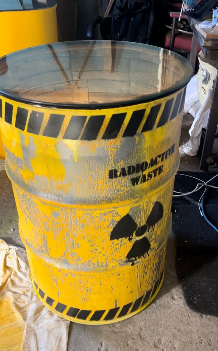 a yellow bucket sitting on top of a cement floor