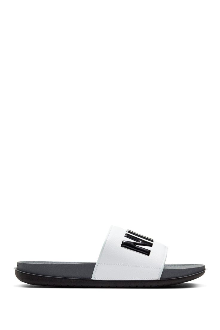 a pair of black and white sandals on a white background