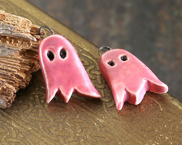 Add a playful, spooky touch to your Halloween jewelry with this hand-crafted charm. The unique pink charm, shaped like a swooping ghost, is an excellent choice for creating distinctive earrings. Handcrafted by Gaea, it embodies a blend of art and whimsy. Whether you're making a charm bracelet or need an eye-catching focal to complete a design, you'll find what you need in this section. We've got everything from metal animal-themed charms to large glass tumbled rings. You can shop them all by mat Handmade Pink Jewelry For Halloween, Pink Dangle Jewelry For Halloween, Quirky Pink Jewelry Gift, Quirky Pink Jewelry As A Gift, Metal Animal, Pink Charm, Halloween 2024, Bead Store, Beads Online