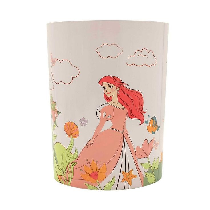 the little mermaid glass is shown with an image of ariel and flowers on it's side