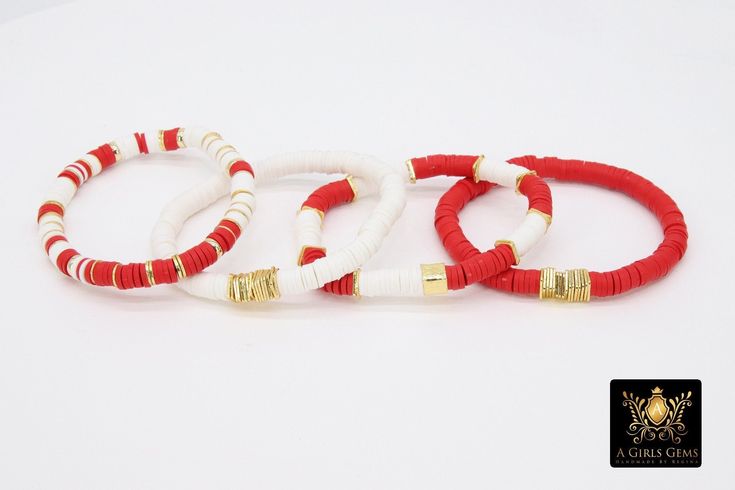 Red, White, and Gold Bracelet in Heishi Beads by Regina Harp Designs These bracelets are in a Red, White, and Gold colors with your choice of bracelet style. They can be made with our other bead colors as well; message us if you would like to customize your bracelet. If you need a smaller or extra large size in the bracelet, please leave us a note with your order. To measure your wrist size you can wrap a piece of string around your wrist and mark it. Then lay the string down flat and measure how long it is and that is your bracelet size. **SPECIFICATIONS** Measurements Approximately: Length is 6.5~7 inches Stones: 6 mm Heishi clay beads Quantity of Items: 1 bracelet unless otherwise selected Materials: Fiber stretchy cord, Brushed gold beads, gold or purple letters Ships in Jewelry Organz Beach Red Friendship Bracelets With Colorful Beads, Red Bohemian Bracelets With Letter Beads, Red Beaded Bracelets With Letter Beads For Beach, Red Heishi Beads Friendship Bracelets, Bohemian Red Bracelets With Letter Beads, Handmade Red Stretch Bracelet With Heishi Beads, Handmade Red Stretch Bracelet For Beach, Beach-friendly Red Colorful Beads Friendship Bracelets, Adjustable Red Letter Beads