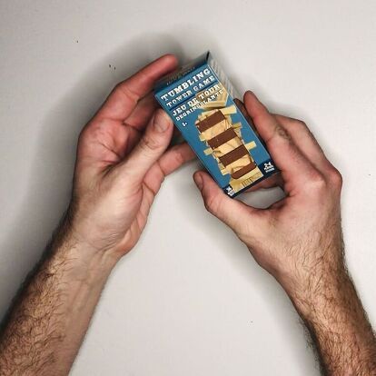 a man holding up a box of ice cream