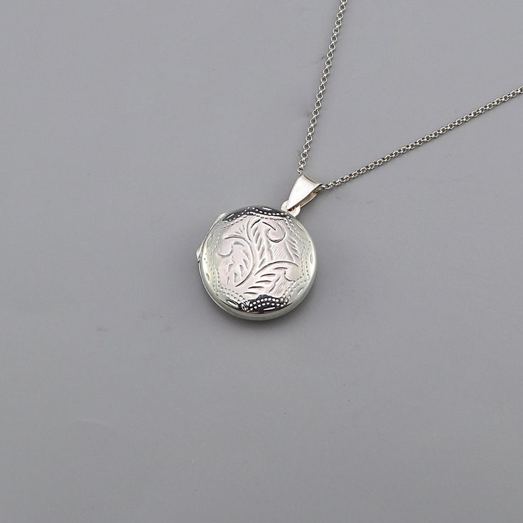 Round locket necklace silver chain,925 Sterling Silver Round Locket Necklace Chain, Silver Necklace, Unisex Silver Necklace CODE: PNK43 Metal: 925 Sterling Silver Locket size: 22mm W x 30mm H Chain Length: 16 Inch, 18 Inch   Chain Extension: 1.5 Inch Finishing: Silver Weight: 5.55 Gram Price Per Piece This beautiful 925 Sterling Round locket necklace silver chain would be a perfect gift for that special someone in your life Buy this necklace for your wife, daughter, sister, or best friend,  and know that without a doubt you have purchased the perfect present  for the any occasion, whether it is for mother's day,  valentines-day, Christmas, graduation or their birthday. It is designed to offer an artistic and lovely look.  This modern world requires something that makes you feel comfortable Locket Necklace Silver, Round Locket Necklace, Chain Silver Necklace, Silver Locket Necklace, Round Locket, Sterling Silver Locket, Silver Locket, Silver Lockets, Chain Silver