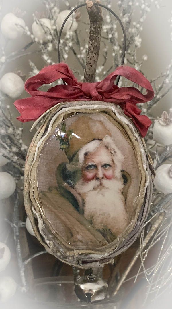 a christmas ornament with a santa clause on it