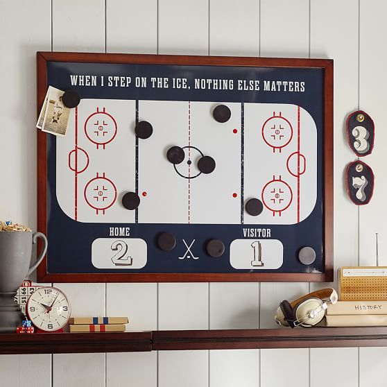 an ice hockey board mounted on the wall above a shelf with books and other items