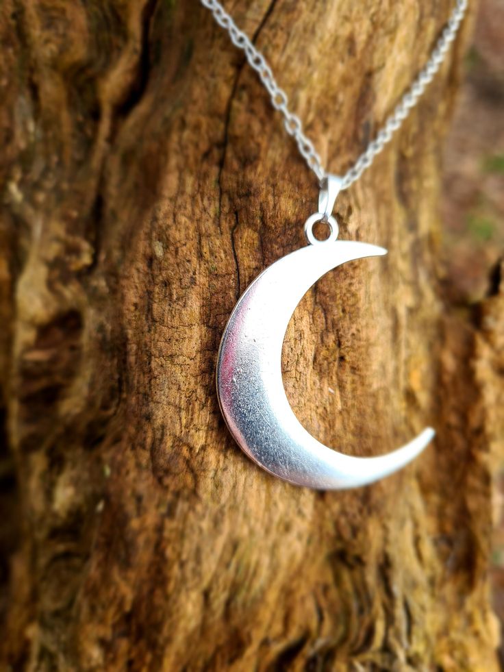 Large crescent moon pendant necklace, makes a great statement to an outfit! Pendant Size: 4.4x1.3 inch. Necklace length: 18inch Silver colour zinc alloy Silver Crescent Moon Phase Charm Necklace, Silver Crescent Moon Phase Necklace, Crescent Moon Phase Metal Necklace, Silver Half Moon Charm Necklaces, Silver Half Moon Charm Necklace, Silver Crescent Metal Jewelry, Nickel Free Half Moon Silver Necklace, Nickel-free Silver Half Moon Necklace, Nickel-free Silver Half-moon Necklace