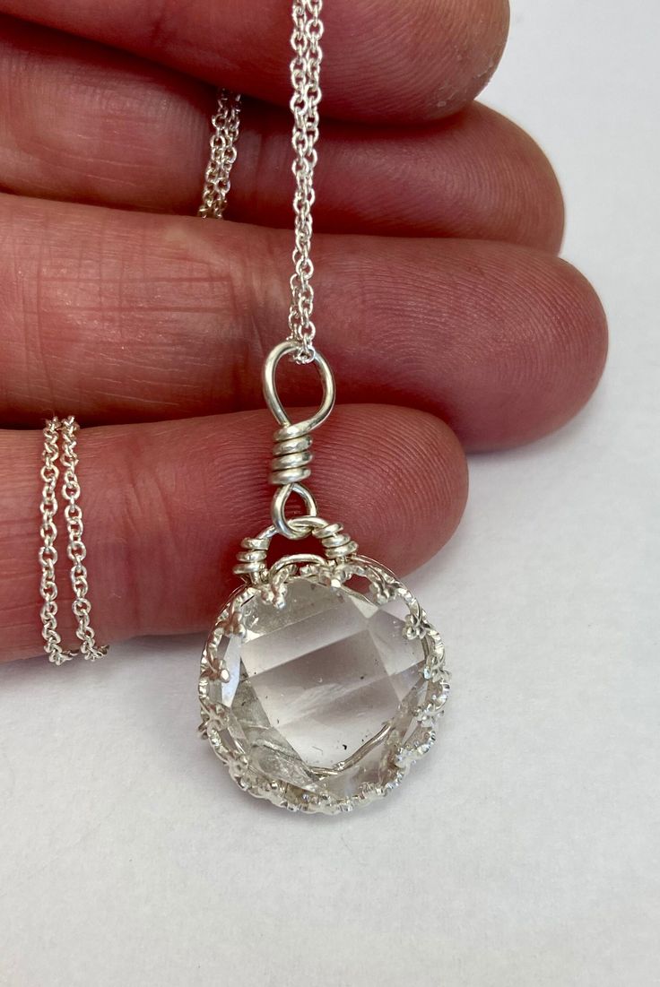 "This pendant features a 12x13 mm, A+ grade HERKIMER DIAMOND quartz crystal. This completely natural double terminated (diamond shaped) quartz crystal was hand mined in Middleville, NY. A clear stone good terminations that is near perfect, with a great tabular shape. This unique wire wrap design has a fancy bezel setting that really shows off clarity of this beautiful stone. You will receive this EXACT pendant. Handmade in the USA with love, by me. I make every piece of jewelry myself. Handcrafted with sterling silver (.925) wire.  Add on a sterling silver chain for a complete necklace if you wish. The 16\" chain is pictured, please note that the longer lengths are slightly thicker.  Herkimer Diamonds are natural double terminated (diamond shaped) quartz crystals found in Herkimer County, Clear Gemstone Crystal Necklaces For Jewelry Making, Crystal Pendants For Jewelry Making, Round Crystal Gemstone Necklaces, Round Crystal Gemstone Necklace, Clear Crystal Gemstone Necklaces, Clear Jewelry With Large Stone As A Gift, Clear Crystal Necklaces With Gemstone, Clear Large Stone Jewelry For Gifts, Diamond White Crystal Necklace For Gift