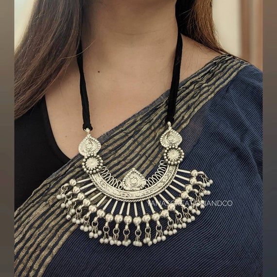 Adorn your beautiful personality with this exquisitely designed and handcrafted statement necklace in oxidised and German SilverPair it up with any formal or semi formal attire and gather compliments at the next event!Necklace length 24 inches . Adjustable length with a black dori at the backNecklace weight 85 GM's*****************************************Order processing time is 2-3 working days.All orders  are shipped from New Delhi,India through Indian Postal servicesDelivery time varies betwe Beautiful Personality, Traditional Indian Jewellery, Indian Wedding Photography Poses, Oxidized Necklace, Unique Pendant Necklace, Back Necklace, Statement Choker, Jewelry Choker, German Silver