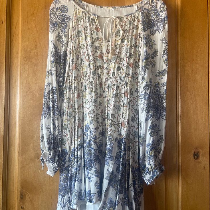 Free People Long Sleeve Maxi Dress Size Small/Petite Short In Front Little Longer In Back! Never Worn And In Excellent Condition. Under Lining Is Nice So You Don't Have To Wear A Slip. Material Is A Cotton Mix....Soft! White Knee-length Viscose Dress, White Viscose Knee-length Dress, Bohemian Viscose Floral Print Dresses, Bohemian Viscose Dresses With Floral Print, Blue Floral Print Viscose Dress, Blue Viscose Dress For Brunch, Spring Floral Print Mini Dress In Viscose, Spring Long Sleeve Mini Dress With Boho Print, Long Sleeve Mini Dress With Boho Print For Spring