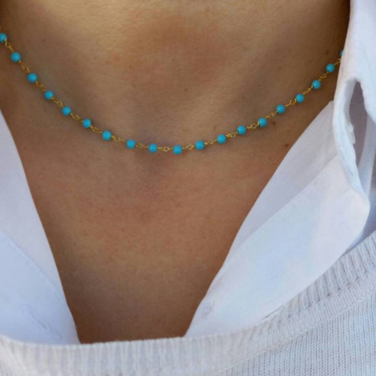 Turquoise Rosary Necklace made of high-quality 925 Sterling Silver coated with 14k gold layers. Classy necklace made of turquoise beads. Appropriate for both everyday or exceptional occasions. Also available in Sterling Silver option. Find similar necklaces here: https://www.etsy.com/listing/606617035/pearl-rosary-necklace-dainty-pearl?click_key=3304f481a68eb9e691254de0272e872262a15ad6%3A606617035&click_sum=631697d2&ga_search_query=rosary&ref=shop_items_search_16&pro=1&frs=1 https://www.etsy.com Dainty Blue Turquoise Necklace As A Gift, Turquoise Beaded Chain Choker, Blue Beaded Dainty Necklace, Turquoise Beaded Choker, Turquoise Dainty Beaded Necklace, Blue Single Strand Choker Jewelry, Dainty Blue Beaded Necklace, Turquoise Beaded Chain Necklace Gift, Blue Beaded Chain Turquoise Necklace As Gift