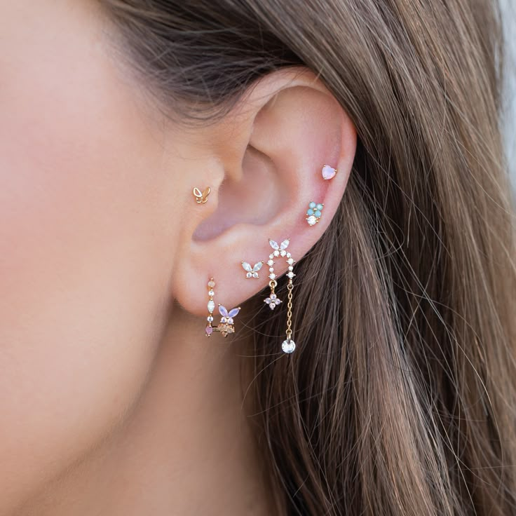 The perfect double piercing look without all the fuss. Our Mari Magic Double Hoops are adorned with butterflies and intricate designs of springtime elements and dazzling stone embellishments. Designed to create the illusion of two piercings, these hoops are sure to catch everyone's attention. Double Ear Piercings Sets, Double Earrings Combinations Ear Piercing, Ear Stacks, Earring Stacks, Lilac Blossom, Dainty Studs, Necklace Chain Lengths, Flower Earrings Studs, Flower Studs