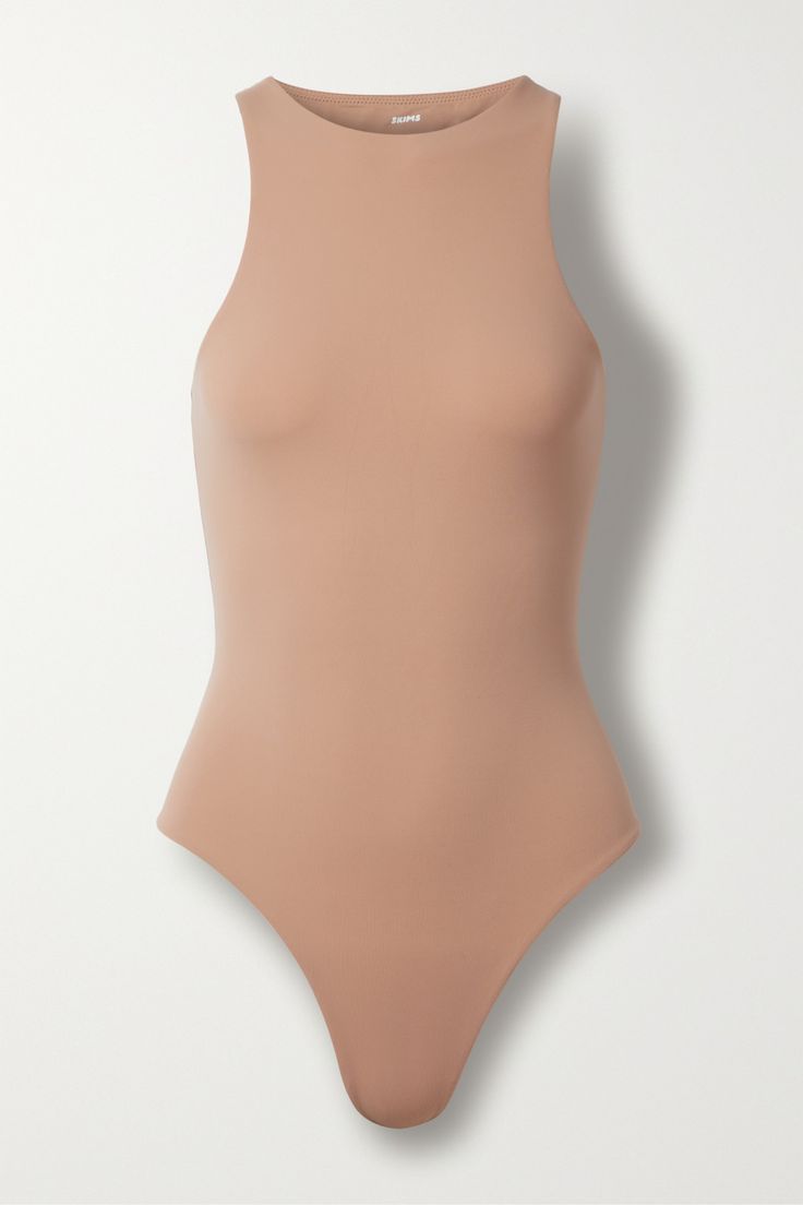 SKIMS' 'Fits Everybody' bodysuit has earned cult status thanks to the way it hugs and sculpts the figure. It's made from double-layered stretch satin-jersey and has a seamless thong back which appears invisible under clothing. Fitted Bodysuit With Boning, Fitted High Cut Bodysuit With Boning, Fitted Sleeveless Bodysuit With Boning, Fitted High-cut Bodysuit With Boning, Seamless Fitted Backless Bodysuit, Fitted High Cut Smoothing Bodysuit, Backless Second-skin Elastane Bodysuit, Smoothing Fitted High Cut Bodysuit, Smoothing Fitted High-cut Bodysuit