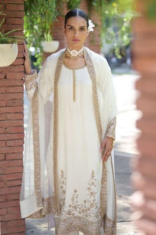 Ivory spun silk kurta with placement floral pattern, contrast gold marodi, sequin and bead embroidery. Paired with straight pant and embroidered dupatta. - Aza Fashions Wedding Palazzo Set With Straight Kurta And Embroidered Border, Wedding Palazzo Set With Embroidered Border And Straight Kurta, Elegant Gold Salwar Kameez With Embroidered Border, Gold Salwar Kameez With Embroidered Border For Designer Wear, Gold Wedding Sets With Embroidered Border, Designer Gold Kurta With Embroidered Border, Gold Raw Silk Salwar Kameez With Embroidered Border, Gold Embroidered Raw Silk Salwar Kameez, Gold Slub Silk Sets With Embroidered Border