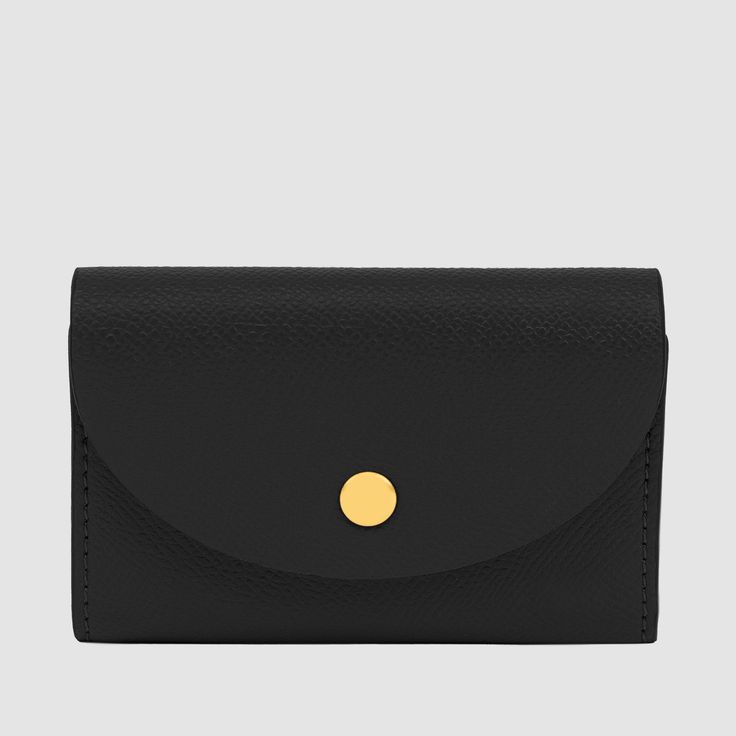 Crafted from our luxurious, textured Recycled Saffiano Leather (outer) and Cotton Twill lining (interior), the Essential Business Card Holder is a classic business card holder in a timeless pouch style, featuring a reliable snap button closure in gold tde. hardware. Specifically designed to comfortably fit standard-sized business and credit cards, the Essential Business Card Holder will keep your cards organised and easily accessible. Dimensions: 7.5cm (H) x 10.5cm (W) x 2cm (D) Pictured here: O Classic Business Card, The Daily Edited, Notes Craft, Card Organizer, Business Card Holder, Recycled Leather, Business Card Holders, Serif Font, Free Gift Wrapping