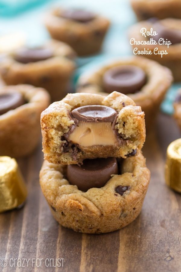 chocolate chip cookie sandwiches stacked on top of each other with one bite being taken out